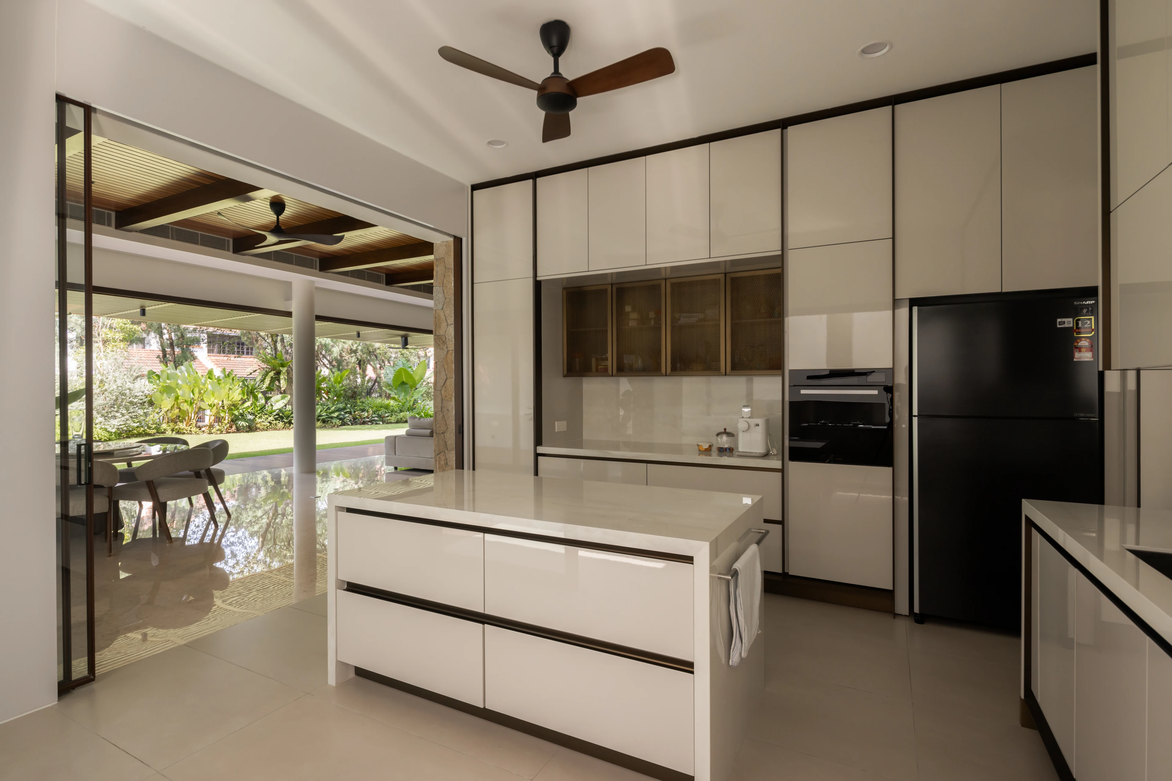 White kitchen cabinetry beside the dining space