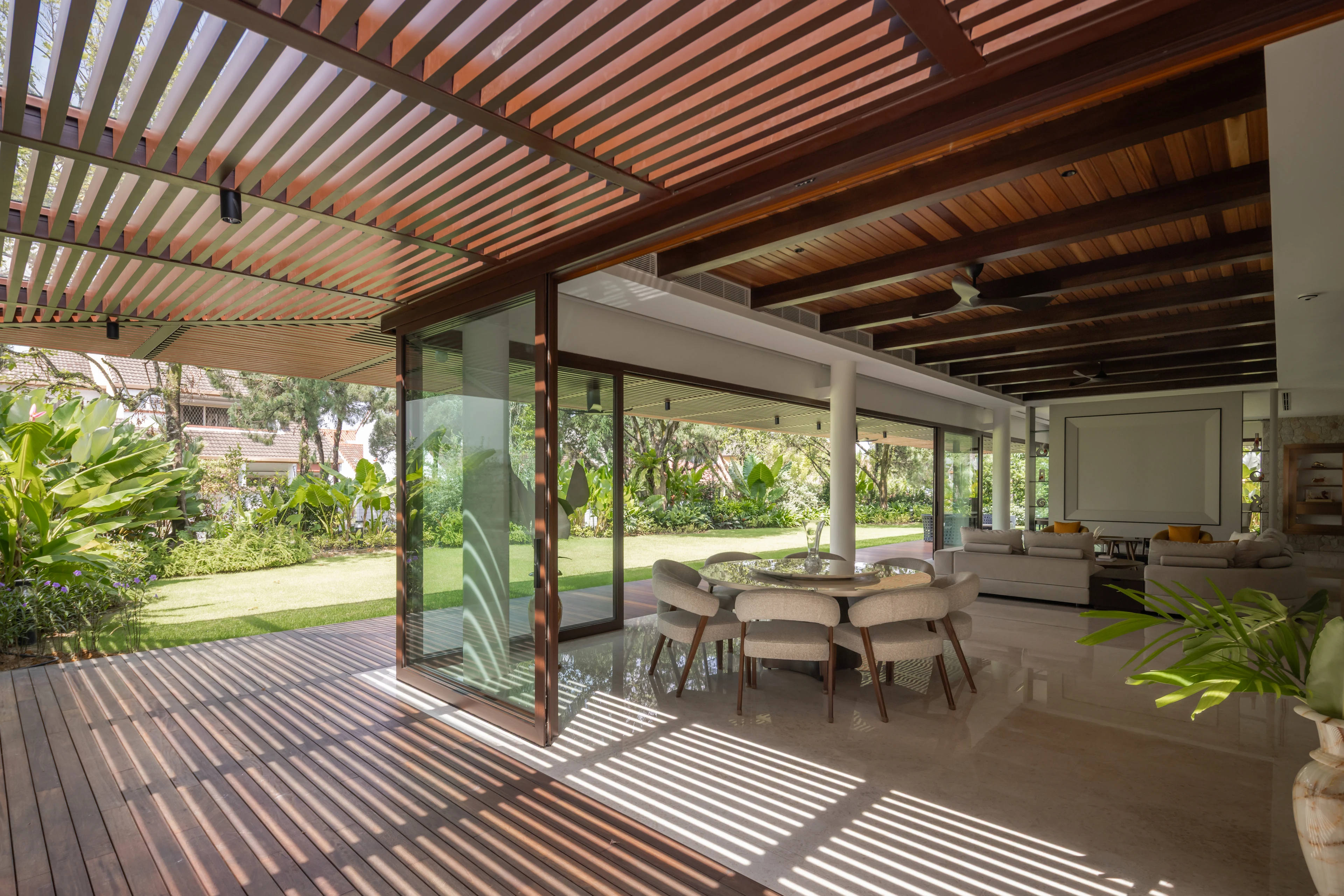Sheltered terrace beneath timber screens