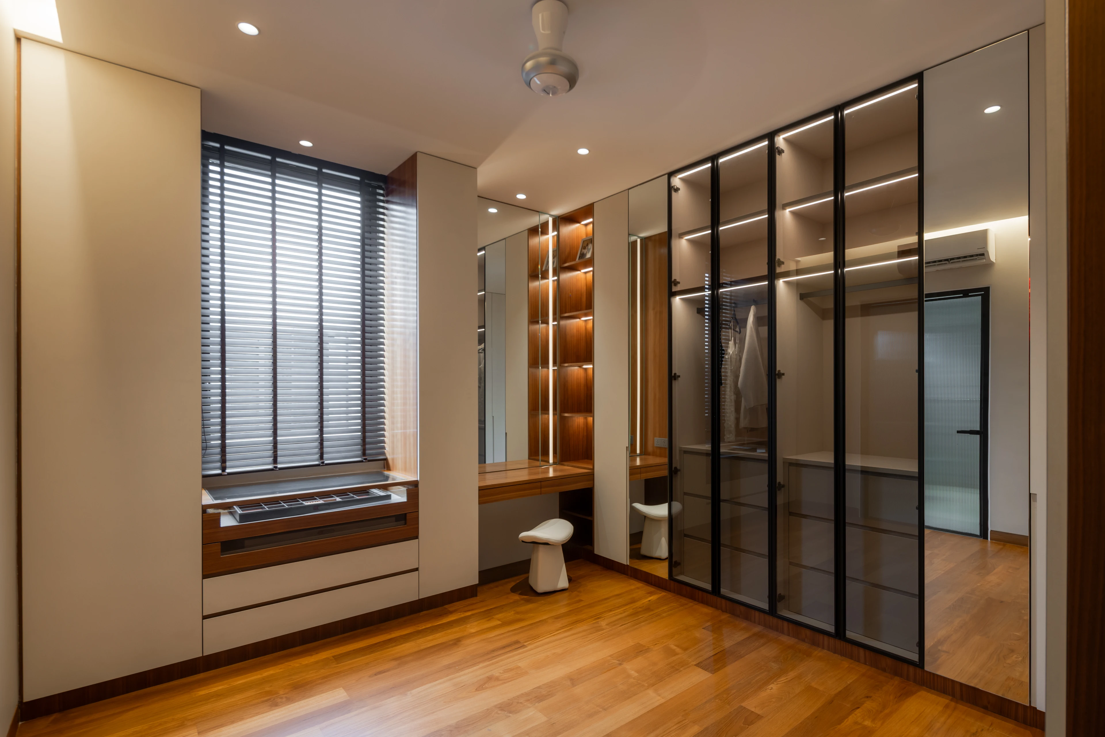 Dressing room with framed glass wardrobe doors